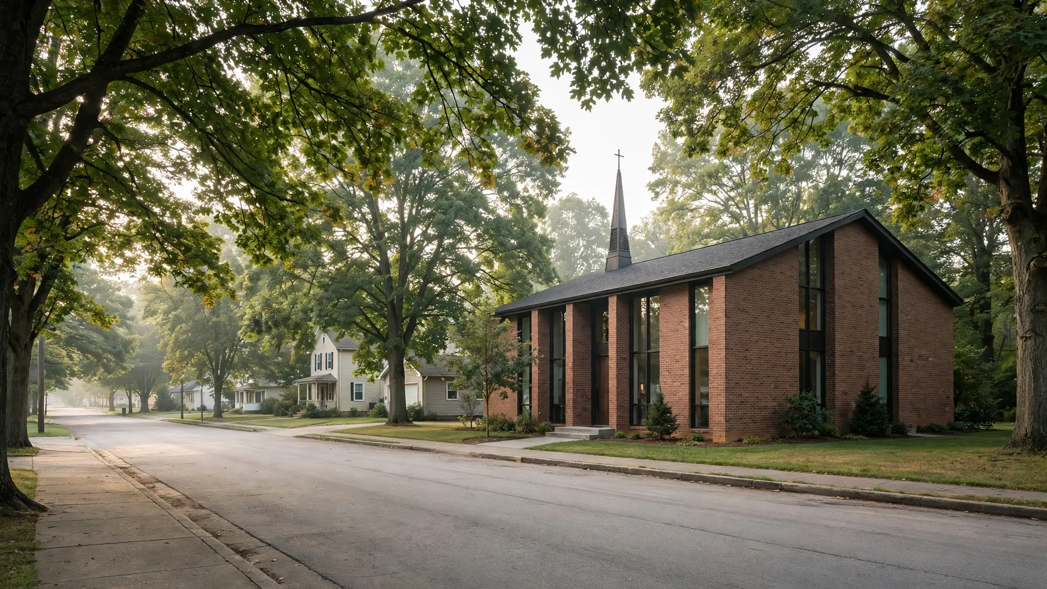 A small modern church building on a quiet street in an American town on a Sunday morning