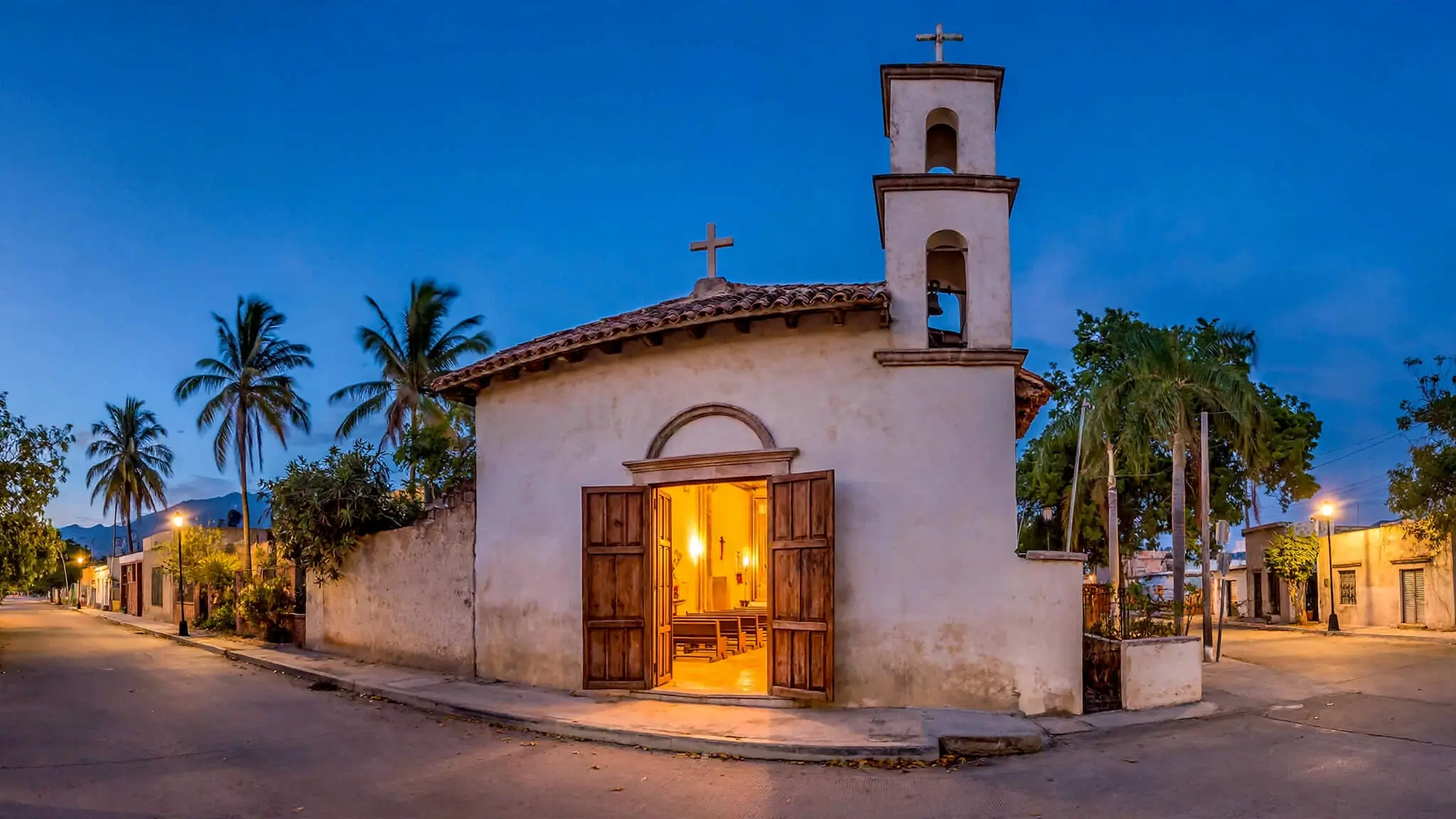 Iglesia parroquial modesta en México al anochecer, con las puertas abiertas y luz cálida, sin personas